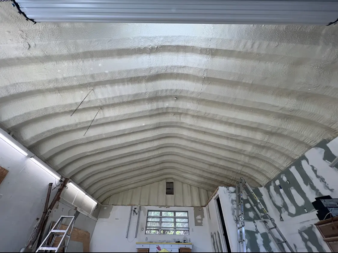 Spray polyurethane foam applied to the underside of a metal roof deck in Hartland